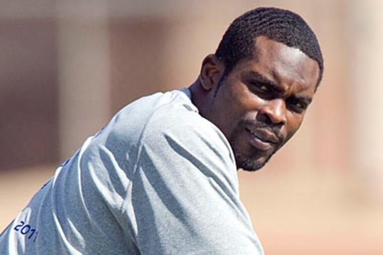 Eagles quarterback Michael Vick will not attend a Super Bowl party that was billed as being his own. (Eugene Tanner/AP)