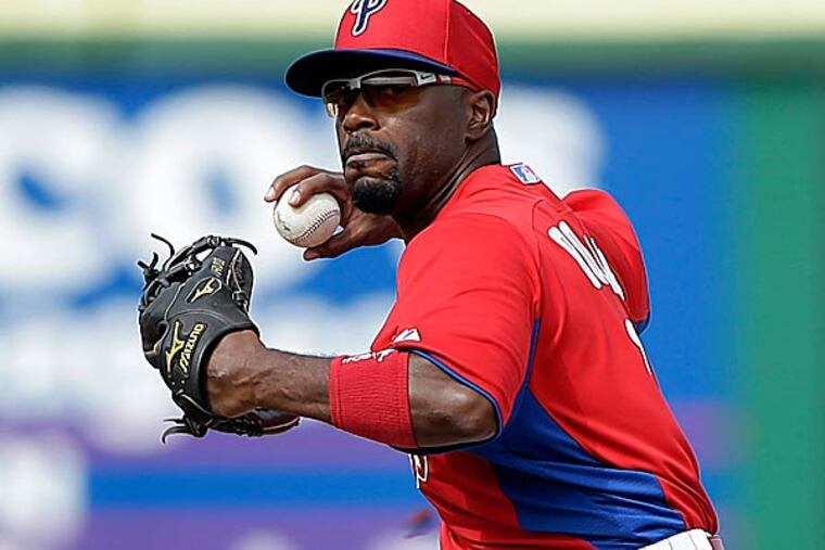 The Phillies' Jimmy Rollins forces out the Yankees' Ichiro Suzuki at second base on a fielder's choice. (Matt Slocum/AP)