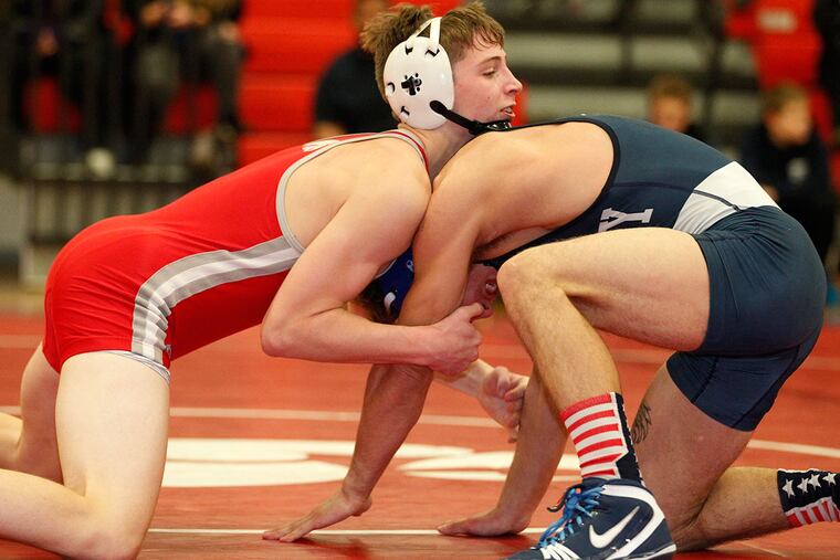 Haddon Township's Chris Wolf (left) during his 132-pound match against Reggie Davis of Gateway on Jan. 13. Wolf won by decision.