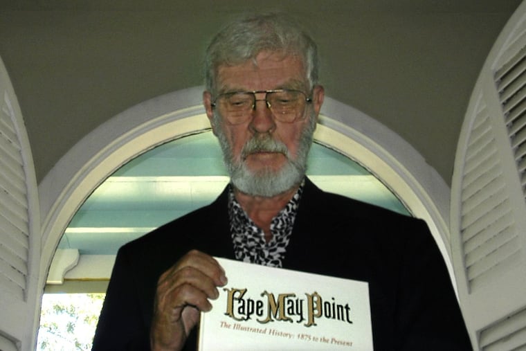 Professor Jordan displays his first book in 2003.