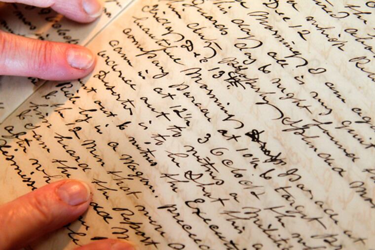 Genevieve Lumia holds the diary at her home in Palmyra, NJ. A Dec. 13, 1861 entry describes a deserter's execution. (AKIRA SUWA/Staff Photographer)