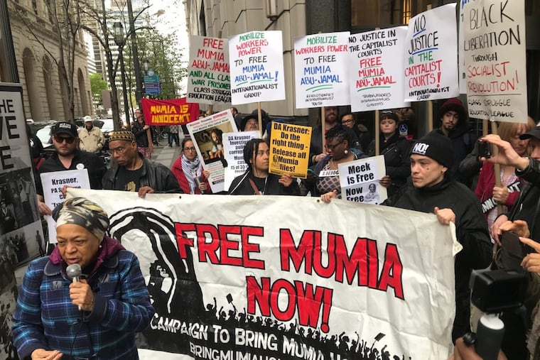Supporters of Mumia Abu-Jamal gather outside the Criminal Justice Center. where a hearing in Common Pleas Court on a challenge to his conviction was being held.