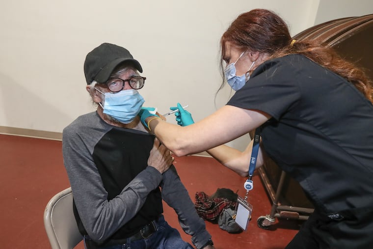 Richard Valier gets is J&J vaccine from Sarah Izzo, RN at the St Paul's Lutheran Church in Doylestown. A vaccine clinic where homeless residents of Bucks County could find the vaccine. Thursday, April 29, 2021.