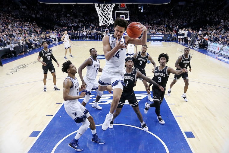 Villanova forward Jeremiah Robinson-Earl (24), seen grabbing a rebound during a game against Providence at the Wells Fargo Center on Feb. 29, was named freshman of the year in the Big East Conference on Wednesday.
