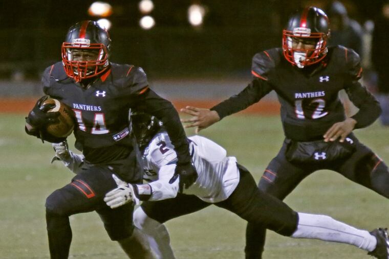 Imhotep Charter halfback Khadarius Sampson (14) runs for yardage in the Panthers’ 33-0 defeat of Bartram in the Public League Class 4A final.