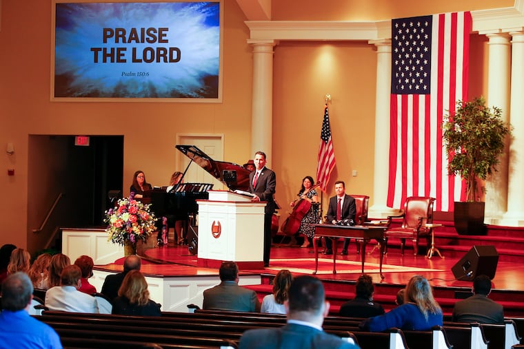 Pastor Charles Clark III conducts service at the Solid Rock Baptist Church in Berlin, N.J., in defiance of Gov. Phil Murphy's closure orders to help stop the spread of the coronavirus.