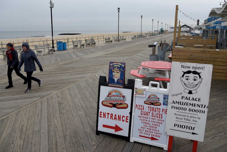 Signs point the way to dining and entertainment on the Asbury Park Boardwalk.