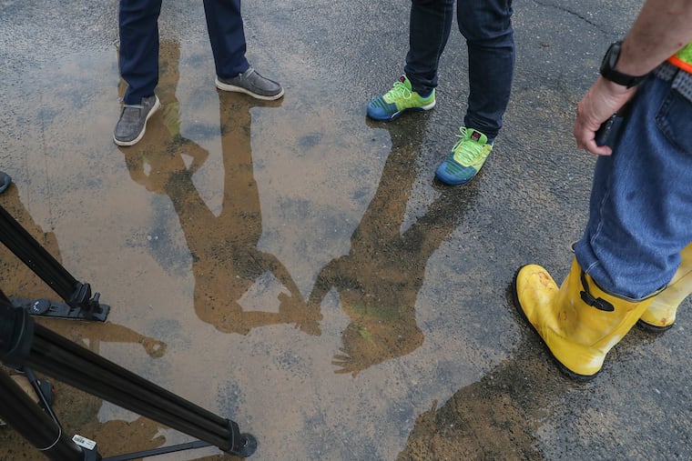 Philadelphia Water Department officials speak with reporters near Fourth and Berks after a large water main break occurred early Thursday morning in North Philadelphia on June 23, 2022.