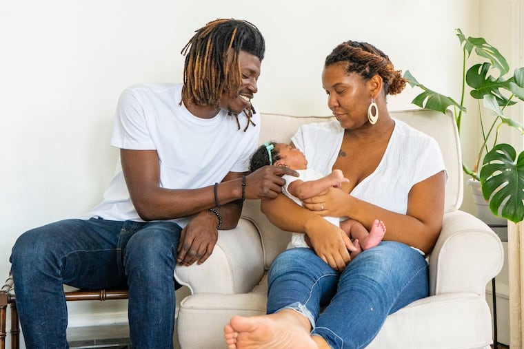 Joey and Kia with daughter Luna.