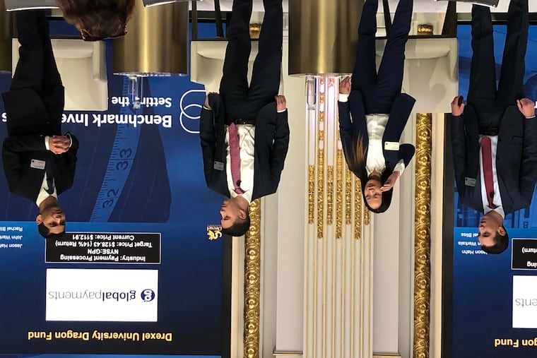 Drexel University MBAs with the Dragon Fund present their best investment ideas at the New York Stock Exchange, Jan. 22, 2019. From left: Maxwell Goldstein, Rachel Bliss, Dean Blank and Soham Mukherjee.