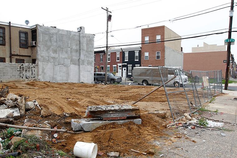 This vacant lot at 24th and Federal Streets in Point Breeze was the site of a building that was demolished in 2014. An inspector said the contractor did not have the required permits. MICHAEL BRYANT / Staff Photographer