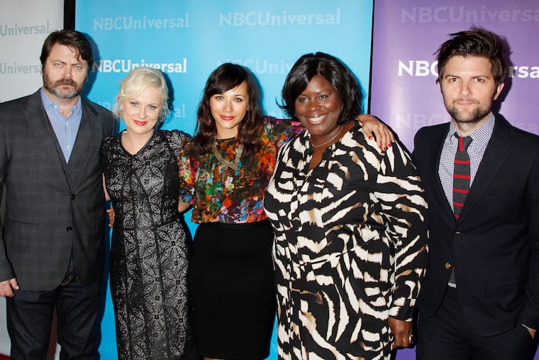 The cast of Parks and Recreation (from left) Nick Offerman, Amy Poehler, Rashida Jones, Retta Sirleaf, and Adam Scott, arrive for the NBCUniversal Press Tour Party in Pasadena, Calif., in 2012. Photo by Francis Specker