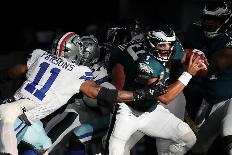 Dallas Cowboys linebacker Micah Parsons pursuing Eagles quarterback Jalen Hurts last season. Parson was traded last week to Green Bay and is no longer a focus for the Birds' defense.