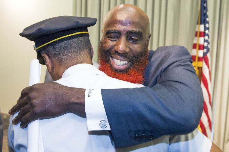 Tariq El-Shabazz, to be ranking deputy later this year, with Police Commissioner Richard Ross.