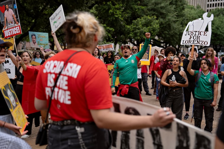 People protest after Lorenzo Salgado Araujo was shot and killed during an immigration stop in Houston this month.