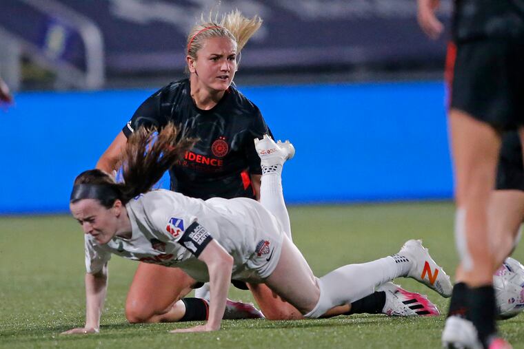 Lindsey Horan (rear) and the Portland Thorns face a must-win game in the NWSL Challenge Cup against OL Reign, while Rose Lavelle (front) and the Washington Spirit play the upstart Houston Dash.