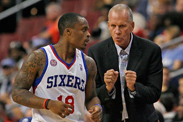 Maalik Wayns talks to Doug Collins during the first half of Wednesday's preseason win over the Cavaliers. (H. Rumph Jr/AP)