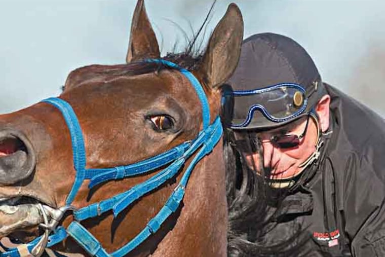 Jockey Tony Black atop Anonymous Donor during an easy workout at Parx Race Track, Bensalem, February 18, 2013. ( DAVID M WARREN / Staff Photographer )