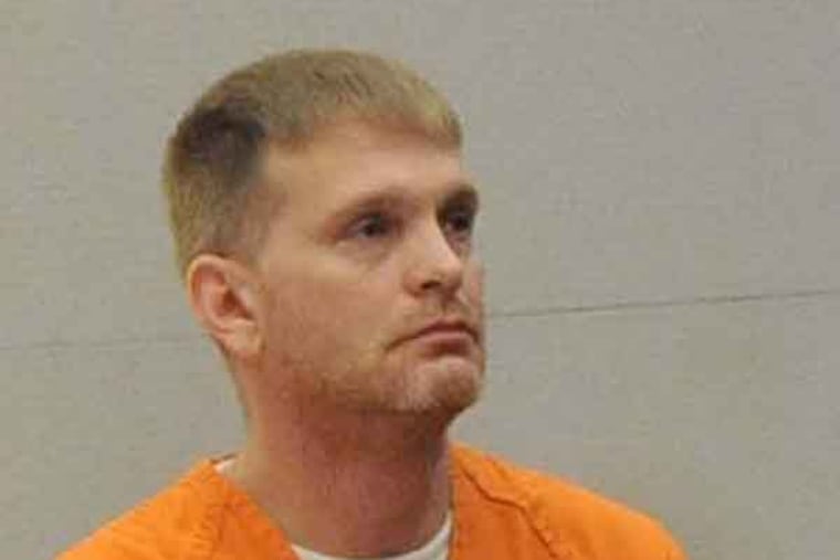 Gerald Tittermary, Jr., nephew of Frederick Hart, right, speaks to admitted murderer Steven Goff in court, Friday July 19, 2013 in Mays Landing, N.J. Goff, a guilt-ridden New Jersey man who confessed this year to having killed a teenager 23 years ago was sentenced Friday to 30 years in prison, after telling the victim's relatives: "You deserve to see me suffer." (AP Photo/The Press of Atlantic City, Michael Ein) MANDATORY CREDIT