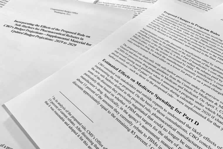 A report released on Thursday, May 2, 2019, by the Congressional Budget Office is photographed in Washington. Budget experts for Congress say the Trump administration’s plan to reduce out-of-pocket drug costs for Medicare beneficiaries will cost taxpayers another $177 billion from 2020-2029. (AP Photo/Jon Elswick)