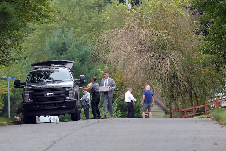 State Police investigate the scene on Vermont Lane in West Bradford Township where Bruce Rogal crashed his car into the home of his ex-wife.