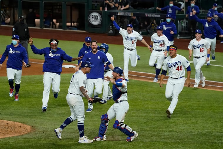 The Dodgers celebrate after defeating the Rays, 3-1, to win the World Series in Game 6 Tuesday.