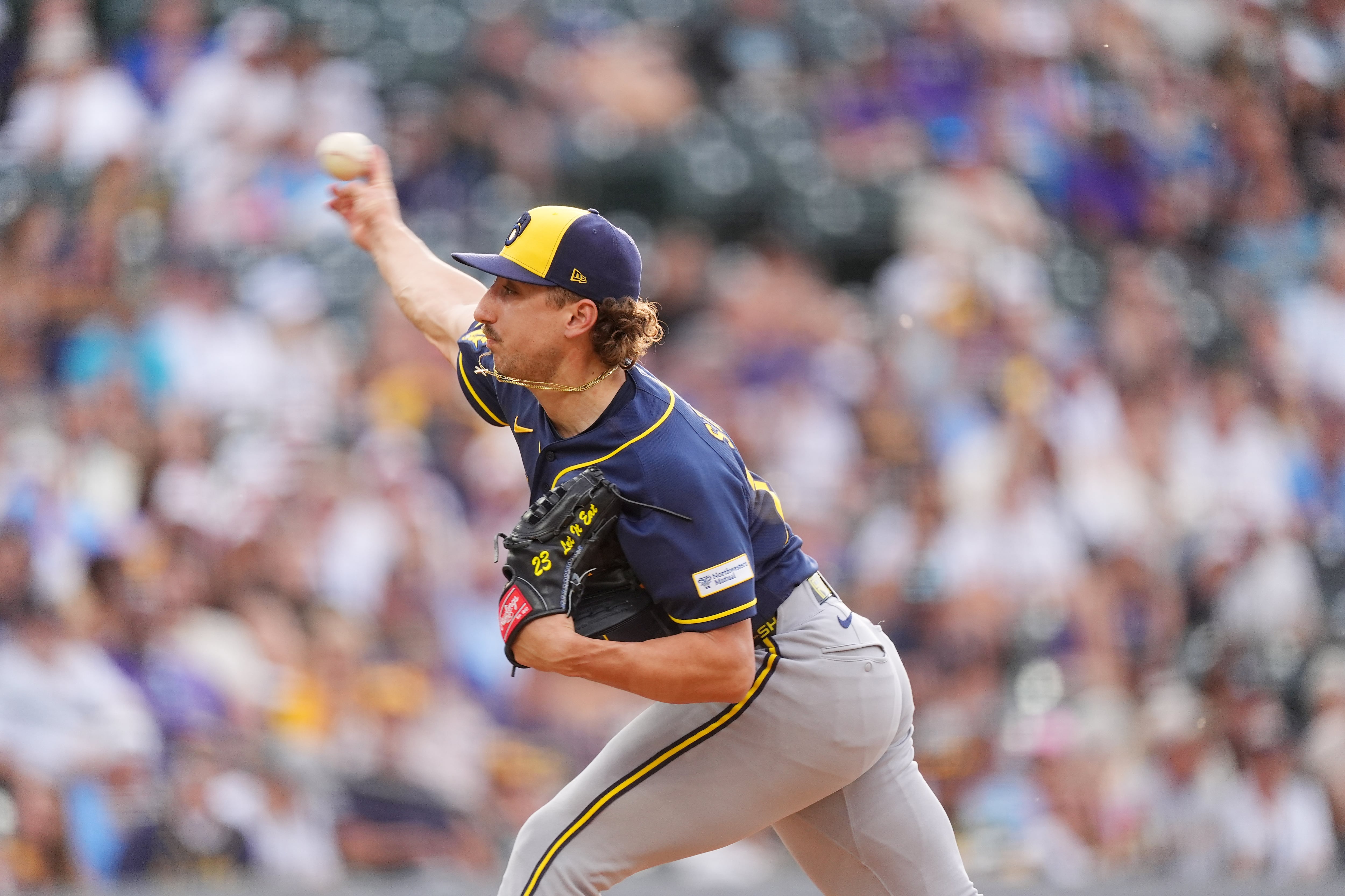 Brewers score 8 late runs, stun Rockies 9-7 in wild 10-inning victory