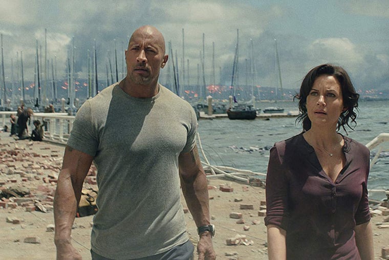 Dwayne Johnson and Carla Gugino in the movie "San Andreas," where their characters' impending divorce was just one disaster they faced together.