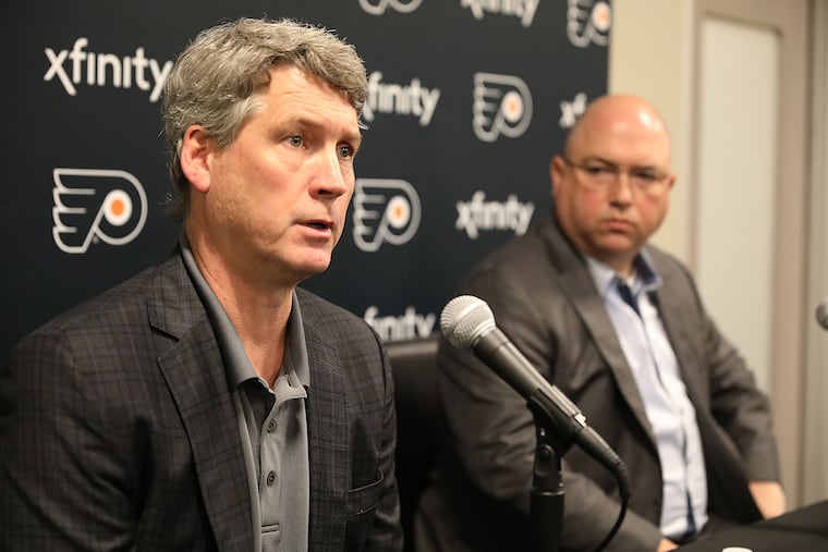 Flyers general manager Chuck Fletcher (left) and assistant GM Brent Flahr will probably pick around 13th in the NHL draft ... unless they get lucky in the June 2 lottery.