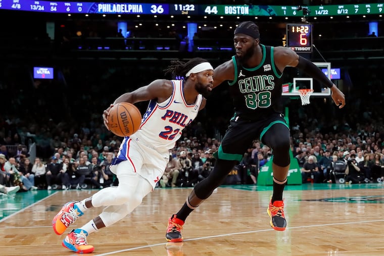 Sixers' Patrick Beverley (22) drives past Boston Celtics' Neemias Queta (88) during the first half on Dec. 1 in Boston.