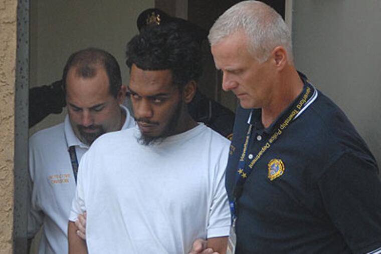 Donnie Sayers is led from Haverford Police HQ in October 2010 after his arrest in connection with a hit-and-run accident that killed a Villanova student. (Curt Hudson / For the Daily News)