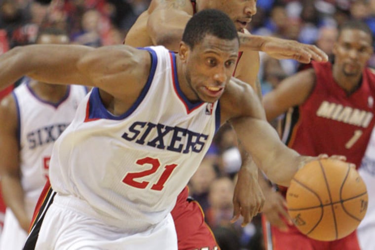 Thaddeus Young steals the ball from the Heat's Rashard Lewis during the fourth quarter. (Steven M. Falk/Staff Photographer)