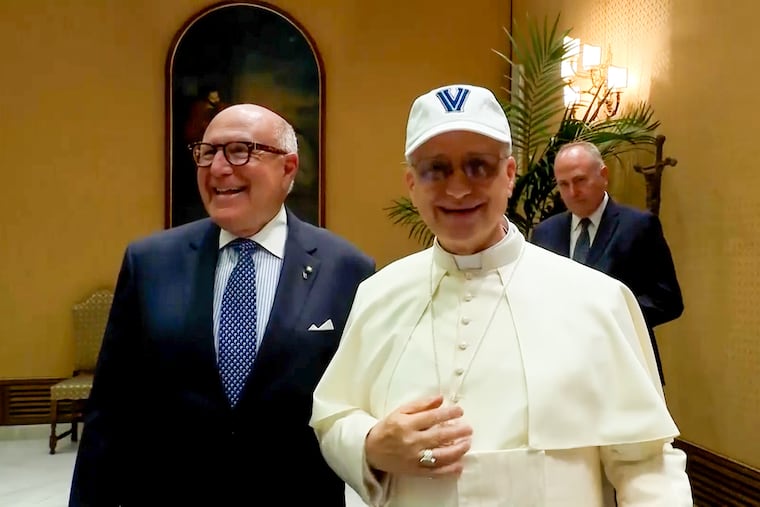 This video screen grab shows Pope Leo XIV wearing a Villanova hat gifted to him during a meeting with an Italian heritage group.
