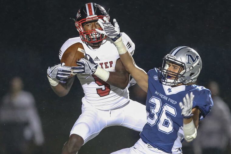 Imhotep Charter's Aamir Brown snags a 44 yard pass over Malvern Prep's David Bolles STEVEN M. FALK / Staff