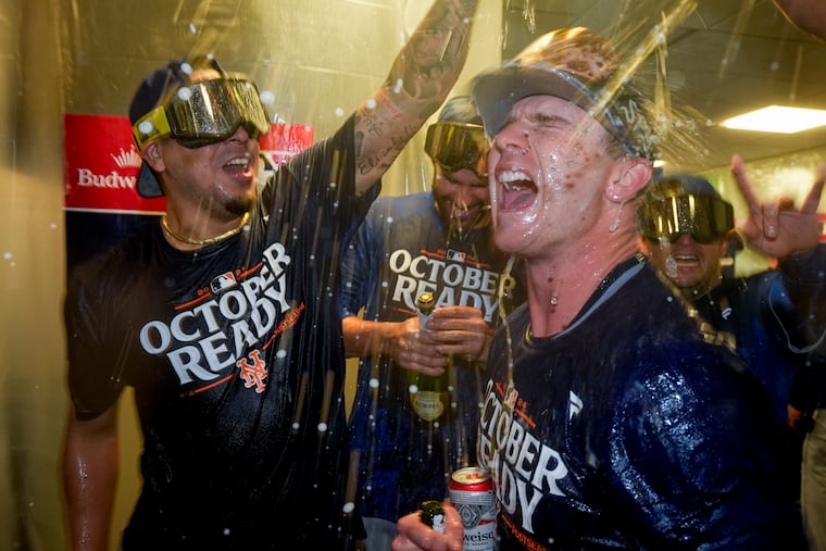 Pete Alonso celebrates with teammates after the Mets won their NLDS series against the Milwaukee Brewers.