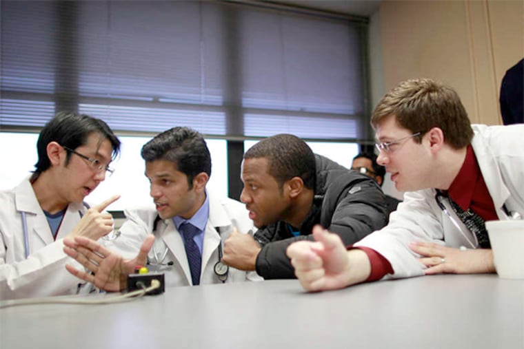 Teams from Albert Einstein Medical Center have won five national Medical Jeopardy crowns, more than any other team. From left, Tany Thaniyavarn, Praveen Ramakrishnan, Chinua Nwakile, and David Wheeler confer. This year's competition is in April.