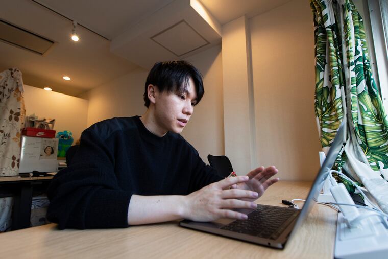 Koki Ozora, a college student who started a nonprofit called "Anata no Ibasho," or "A Place for You," talks with a woman who'd like to help Ozora's organization, as he speaks in his office in Tokyo on Friday, Oct. 2, 2020. Suicides are on the rise among Japanese teens and that worries 21-year-old Ozora, who grew up depressed and lonely. His online Japanese-language chat service, run entirely by volunteers, offers a 24-hour text-messaging counseling for those seeking a sympathetic ear, promising to answer every request, within five seconds for urgent ones. (AP Photo/Hiro Komae)