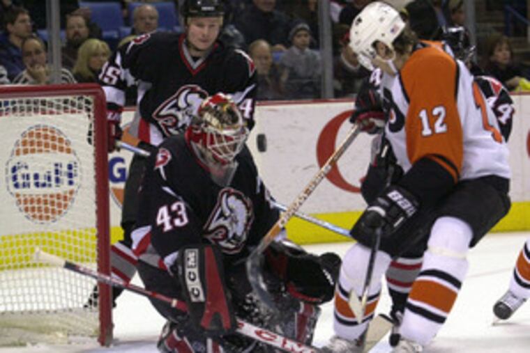 Teammates now, but in 2004 game Simon Gagne (right) could not beat Martin Biron in Buffalo's goal.