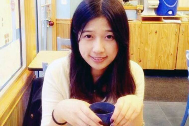 This undated photo provided by Meixu Lu shows Lingzi Lu in Boston. Boston University confirmed Wednesday, April 17, 2013, that Lingzi Lu, who was studying mathematics and statistics at the school and was due to receive her graduate degree in 2015, was among the people killed in the explosions at the finish line of the Boston Marathon Monday, April 15, 2013, in Boston. (AP Photo/Meixu Lu)