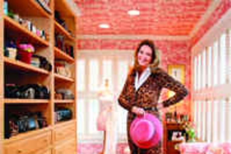 in her fashionable French-inspired closet, with her favorite item, a pink Eric Javits fedora - "They are masculine, but on a woman they are feminine. A little risky." The Gladywne resident and retired senior vice president of institutional advancement at Drexel collects clutches, shoes, and fashion sketches; the dress form sports a lace Jessica McClintock gown.