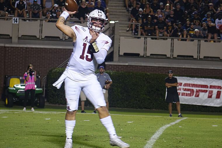 Temple's Anthony Russo completes a screen pass in the first quarter of the Owls' game against East Carolina.