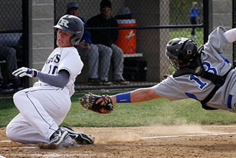 Rustin's Jimmy Brennan slides safely into home ahead of the tag by Great Valley's David Iacobucci. (Michael S. Wirtz/Staff Photographer)