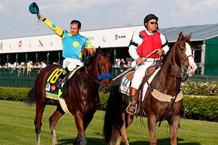 Victor Espinoza aboard American Pharoah celebrates winning the 141st Kentucky Derby at Churchill Downs. (Brian Spurlock/USA Today)