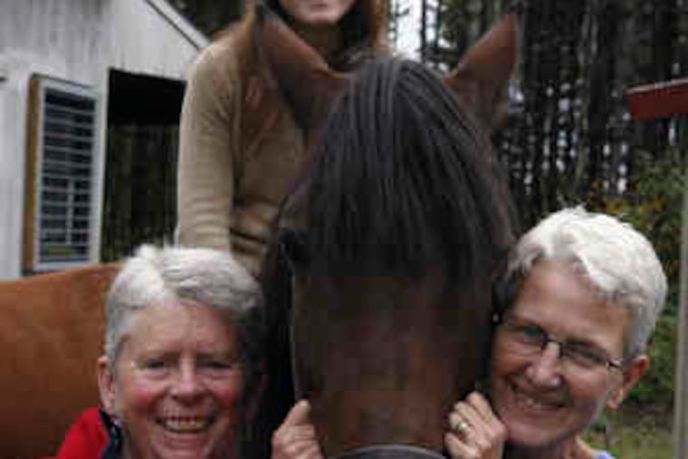Karen Marlin (left) and Judy Chamberlain, together 30 years, with daughter Nena Marlin. Opponents of the marriage law include, below, the Rev. Robert Emrich (left) and Marc Mutty.
