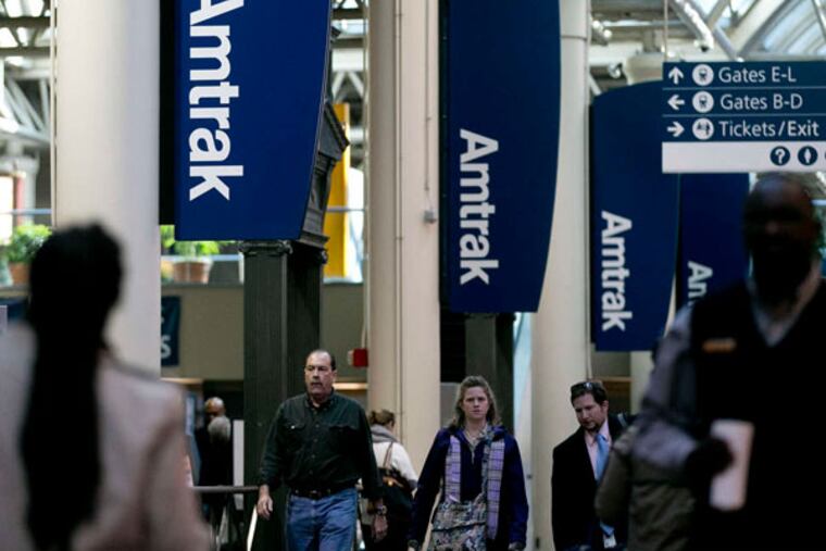 Amtrak signs at Washington's Union Station. Amtrak's 15 routes of more than 750 miles lost $598 million in 2011, according to a study.