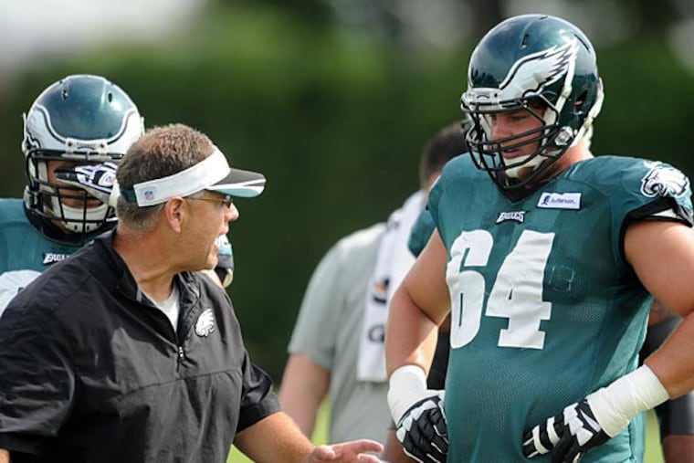 Eagles offensive lineman Matt Tobin listens to instructions from offensive line coach Jeff Stoutland during. (Clem Murray/Staff Photographer)