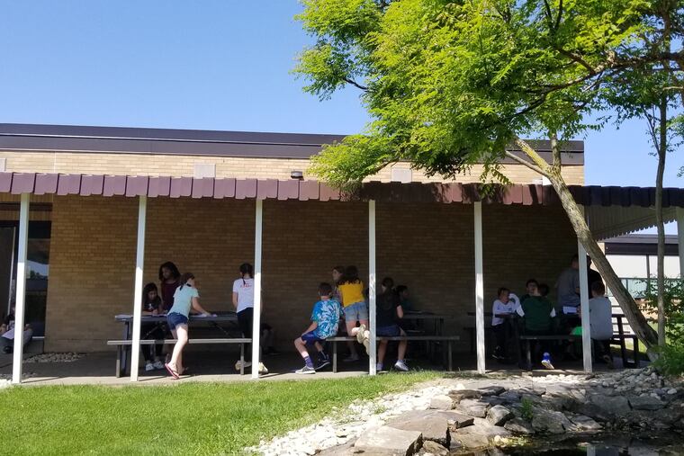 Rostraver Middle School's shade shed, built with a grant from the Pennsylvania Academy of Dermatology, provides shelter from the sun at lunch and recess