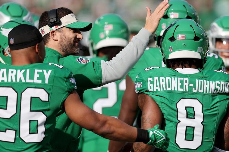 Eagles coach Nick Sirianni congratulates safety C.J. Gardner-Johnson after his first interception against the Cowboys on Sunday.