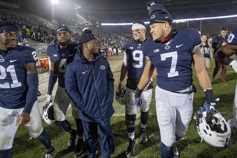 Penn State seniors Amani Oruwariye, Nick Scott, Mark Allen, Trace McSorley and Koa Farmer laugh together as they take a lap around Beaver Stadium after a 38-3 win against Maryland.