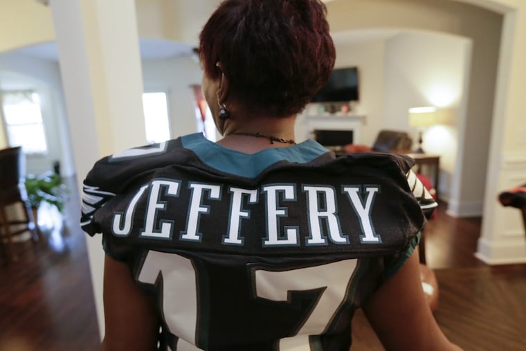 Alshon Jeffery’s mother, Deloris, wears her son’s Eagles jersey at her Gaston, S.C., home.